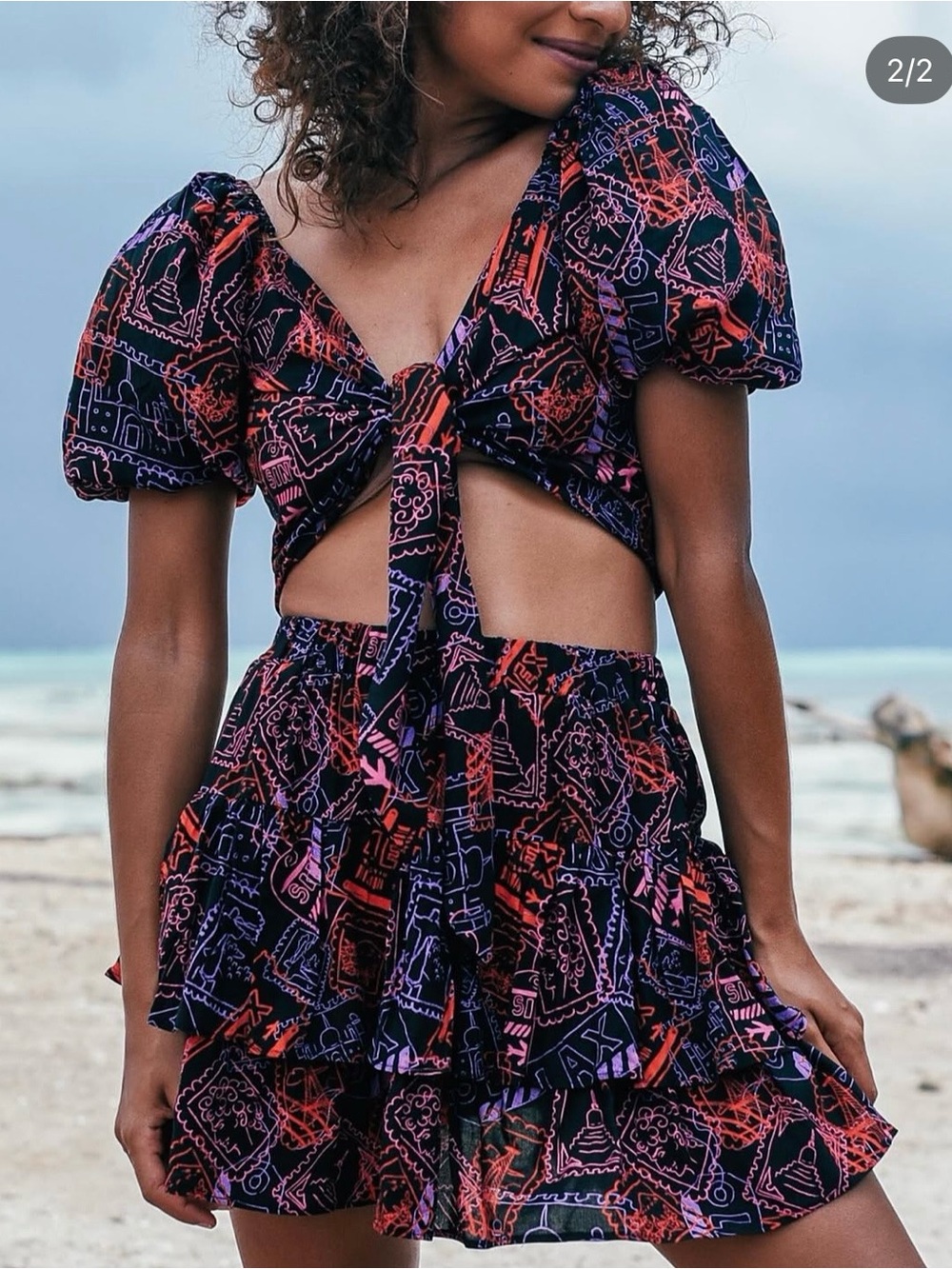 Black Pleated Skater Skirt with Red and Pink Graphic Pattern